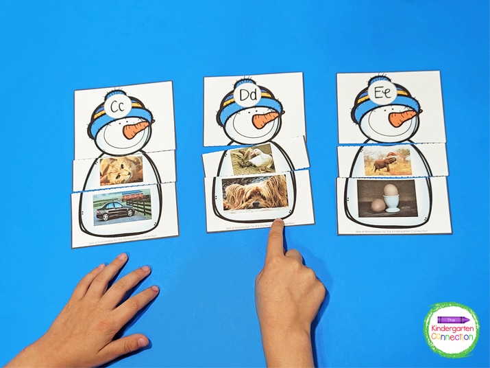 In this beginning sound match, each snowman is made up of one letter card and two photo pieces.