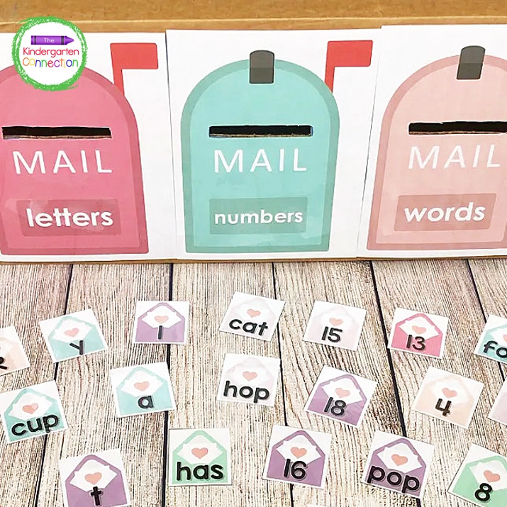To play, take the letter, number, and word envelope cards and spread them out around your box.