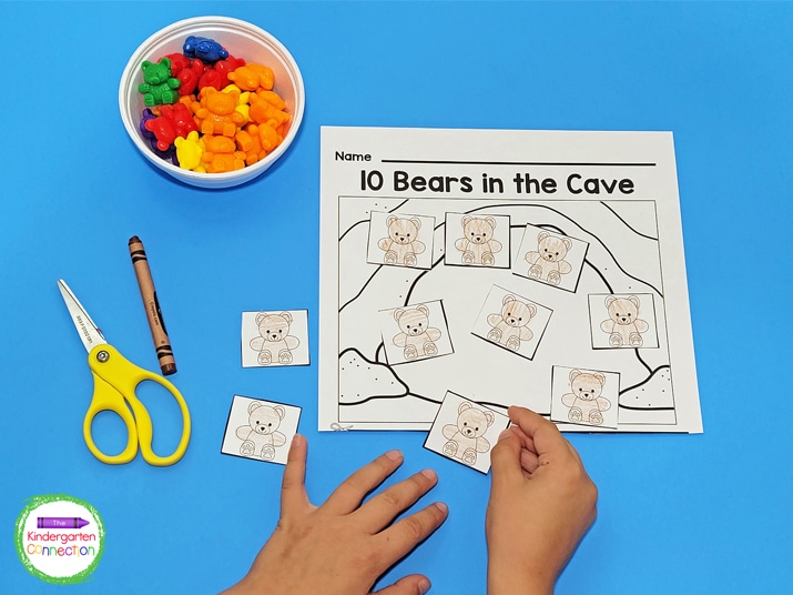 For this counting game you will need the free printable, counting bears, scissors, and crayons.
