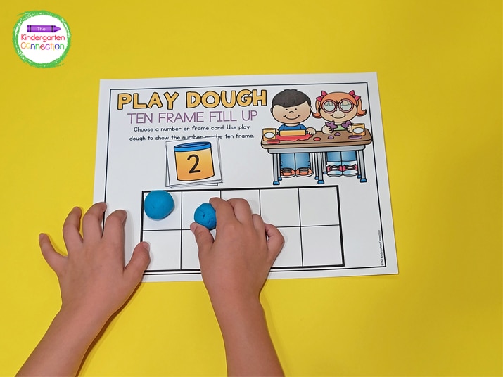 For the Play Dough Ten Frame Fill Up activity, choose a number card and use play dough to fill the ten frame on the mat.