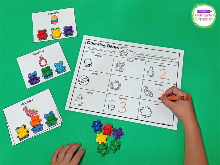 Choose a card, read the word, and use counting bears to show the number of syllables.