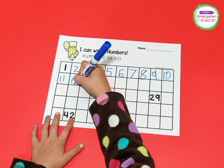 We use fun writing tools like markers to complete these number writing printables.
