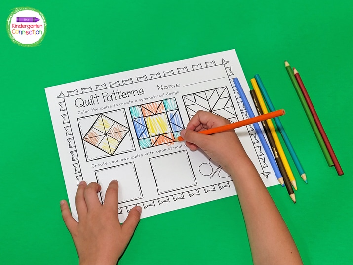This symmetry patterns activity has a top row of quilts for students to color symmetrical shapes.