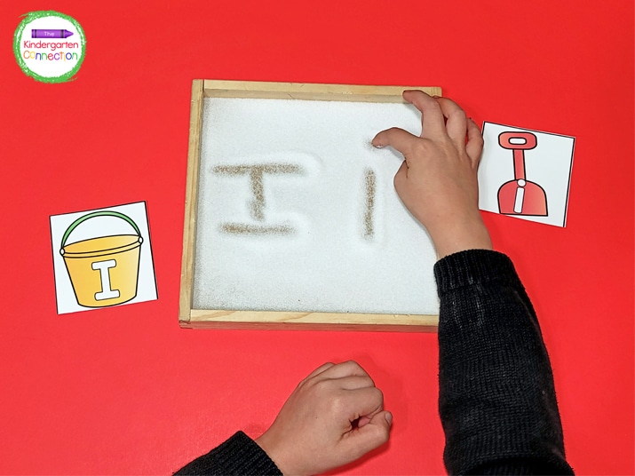 Students can pick a letter card and draw the letter in salt for a sensory element.