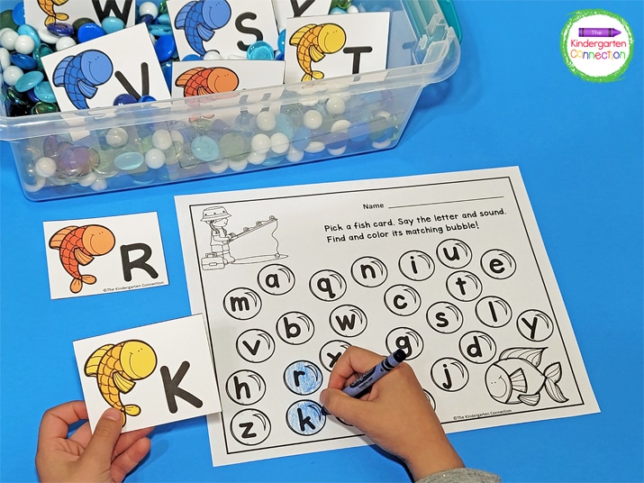 The fish letter cards have uppercase letters and the recording sheet has lowercase letters for matching.