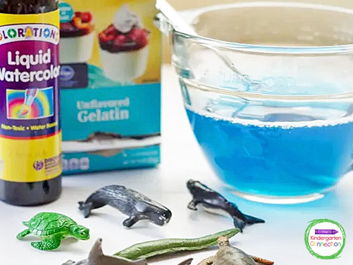 For this activity, you will need a clear container, liquid watercolors, gelatin, and Toob ocean creatures.