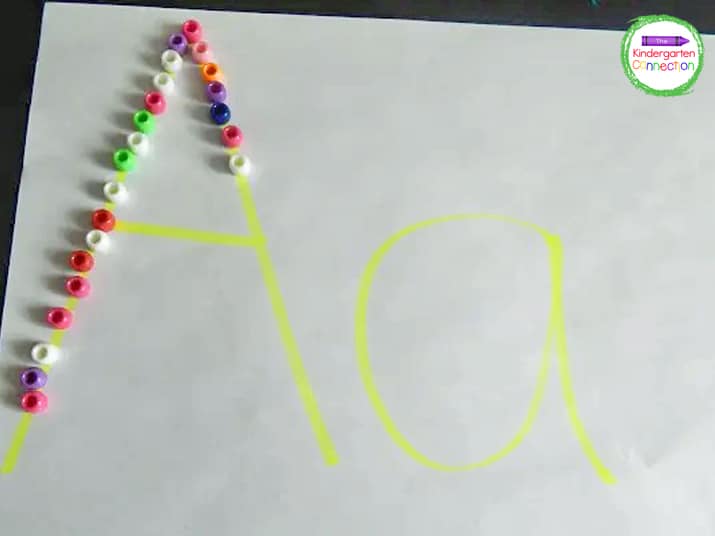 Use beads to trace letters for engaging practice with learning the alphabet.