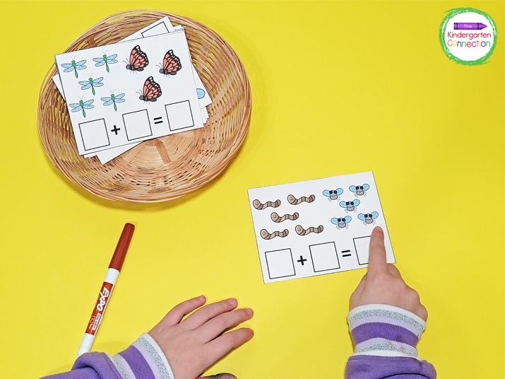 Students practice one-to-one correspondence as they point to each bug to count them.