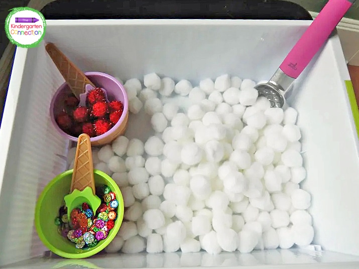 Inside the sensory bin, I added cotton balls for ice cream, pom poms for cherries, and sequins for sprinkles.