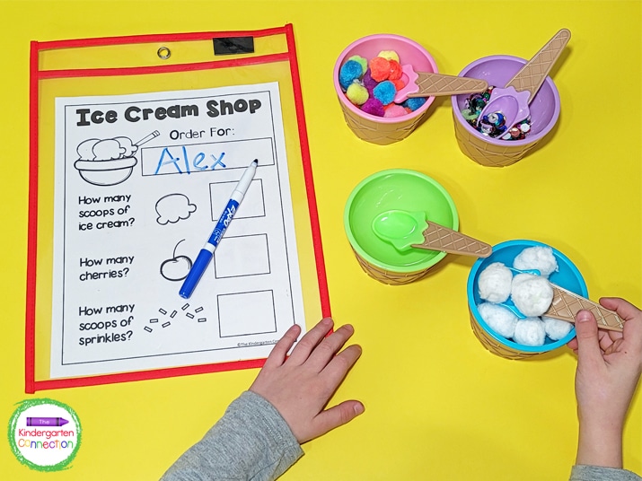 To play, I set out ice cream bowls, spoons, and a fun printable order form for the kids to write the orders on!