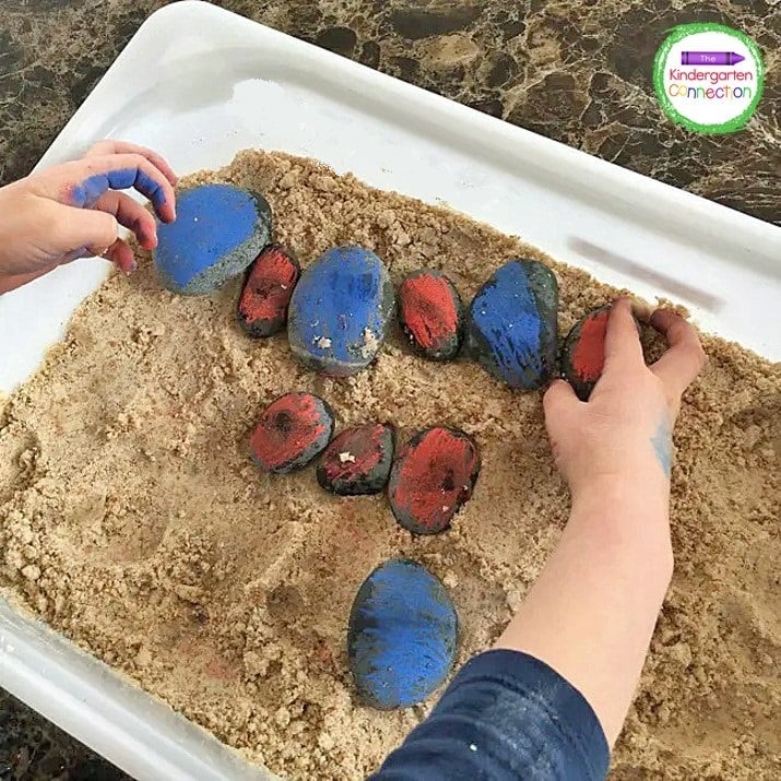 We also created color patterns with the blue and red stones in the sensory bin.