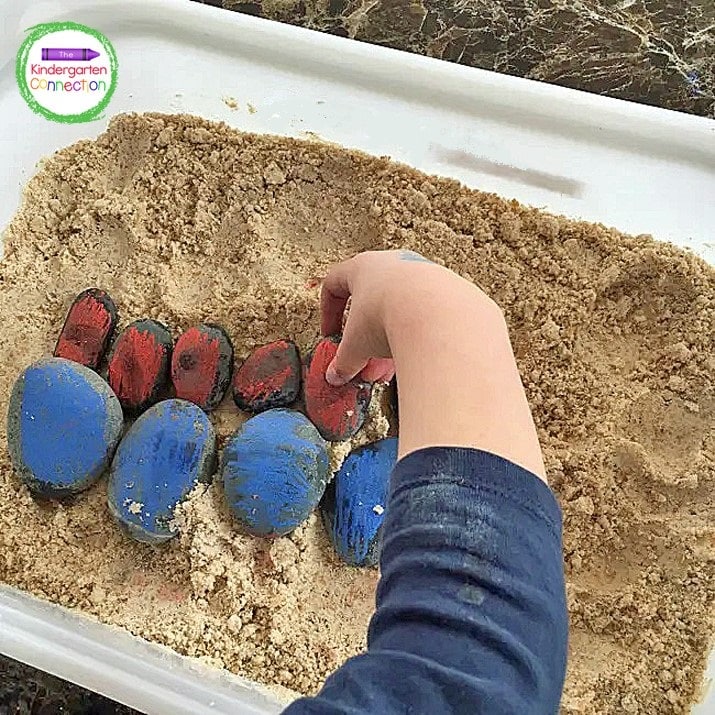 We sorted the stones in the sand sensory bin by color and size.