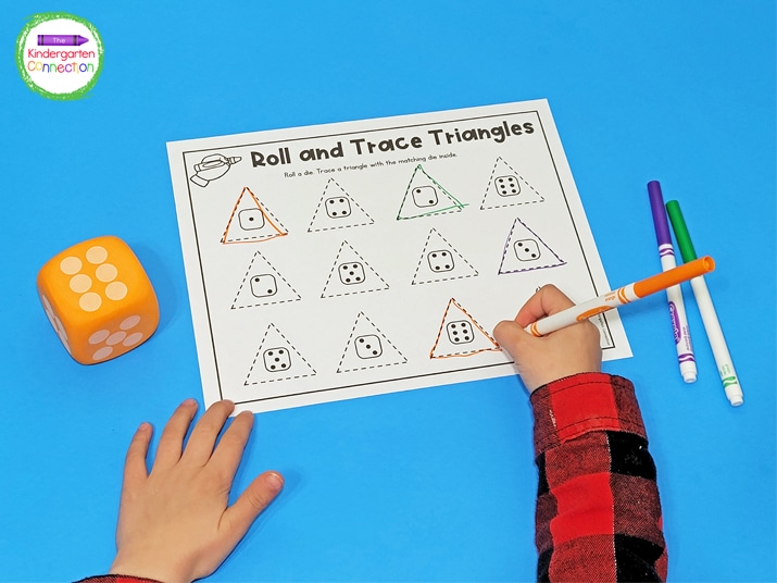 To play Roll and Trace Shapes, students roll a die and trace a shape with the matching die inside.