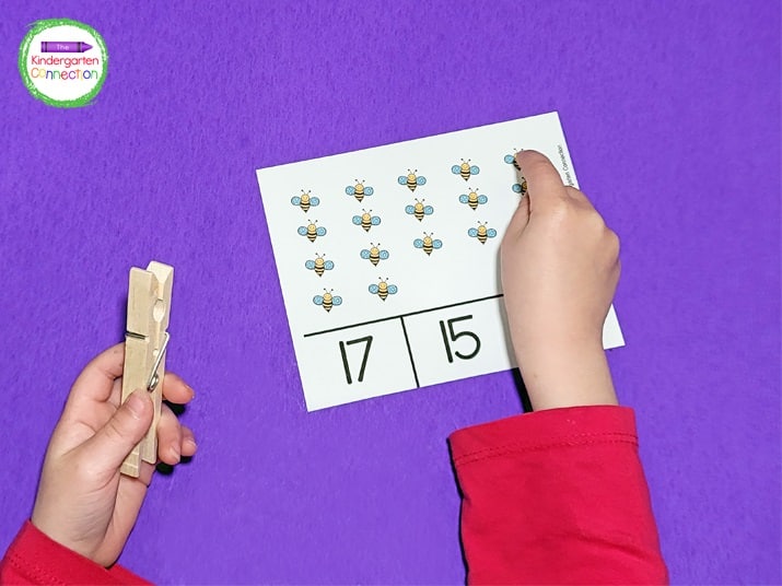 Students count the fun bug pictures on the card and then clip the correct number.