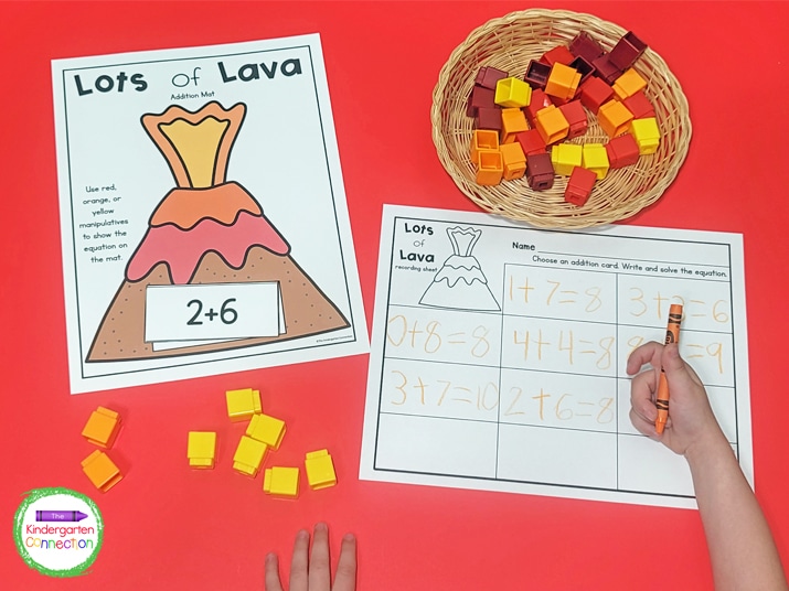 Students place an equation card on the volcano and solve it using lava-colored manipulatives.