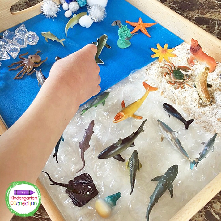 Playing with a small world is the ideal environment to work on early literacy skills together. This under the sea small world is such fun! 
