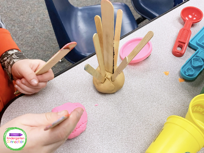 To build fine motor skills, add a variety of tools to use with play dough.