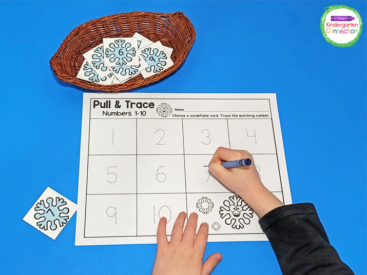 The snowflake printable provides practice with recognizing and tracing numbers.